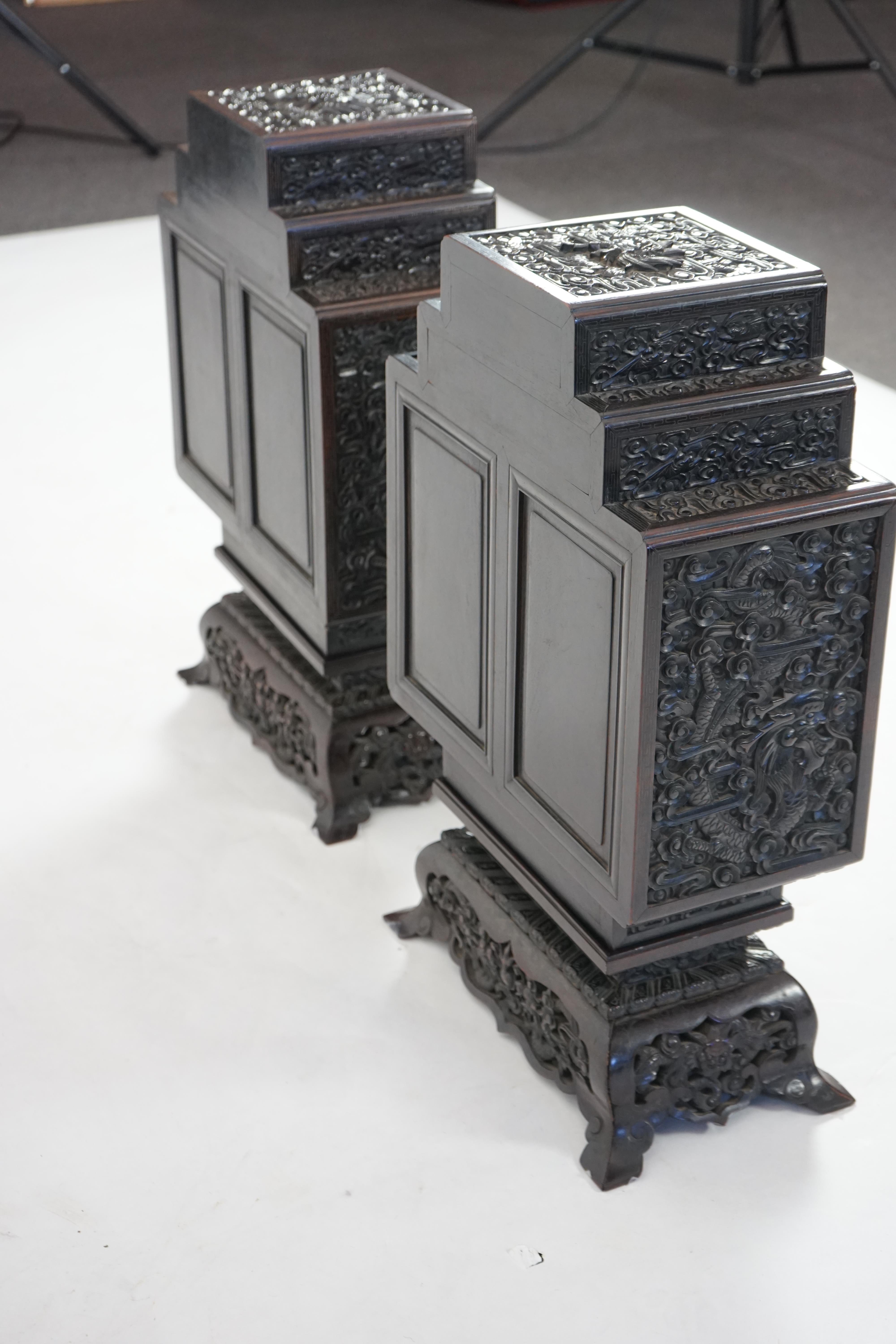 An important pair of Chinese carved zitan and silver wire inlaid ‘cloud and dragon’ curio cabinets and stands, duobaoge, probably Imperial, late Qing dynasty